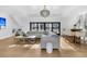 Bright living room with a sectional sofa, wet bar, and large windows at 151 Brailsford St, Charleston, SC 29492