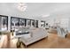 Expansive living room featuring a large sectional sofa, and open layout to the kitchen at 151 Brailsford St, Charleston, SC 29492