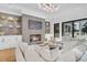Bright living room with a stylish fireplace, large sectional, and seamless indoor-outdoor flow at 151 Brailsford St, Charleston, SC 29492