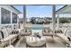 This relaxing living room features wicker furniture and a view of the pool at 151 Brailsford St, Charleston, SC 29492