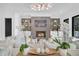 Bright living room with fireplace, decorative shelving, and luxury decor at 151 Brailsford St, Charleston, SC 29492