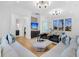 Bright living room featuring modern lighting, stylish seating, and a view of the hall with custom cabinets at 151 Brailsford St, Charleston, SC 29492