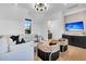 Bright living room featuring modern lighting, stylish seating, and custom cabinets under wall mounted television at 151 Brailsford St, Charleston, SC 29492