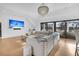 Bright living room with a sectional sofa, and large windows with a view at 151 Brailsford St, Charleston, SC 29492