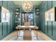 Stylish home office features built-in shelves, ample storage, and custom ceiling details at 151 Brailsford St, Charleston, SC 29492