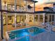 Gorgeous pool area with outdoor seating perfect for entertaining and relaxing at 151 Brailsford St, Charleston, SC 29492