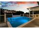 A beautiful pool is surrounded by a patio area, perfect for relaxing and enjoying the outdoors at 151 Brailsford St, Charleston, SC 29492