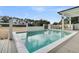 This rectangular pool features views of a grassy lawn surrounded by trees at 151 Brailsford St, Charleston, SC 29492