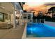 A beautiful pool is surrounded by a patio area with outdoor dining, perfect for relaxing and enjoying the outdoors at 151 Brailsford St, Charleston, SC 29492