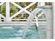Relax by this waterfall edge pool with lush landscaping at 151 Brailsford St, Charleston, SC 29492