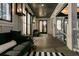 The home features an inviting front porch with a seating area, ideal for relaxing and enjoying the outdoors at 151 Brailsford St, Charleston, SC 29492