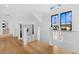 Bright, modern staircase with metal cable railing and custom lighting at 151 Brailsford St, Charleston, SC 29492