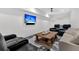 Cozy theater room with comfortable seating and a large flat-screen television for entertainment at 151 Brailsford St, Charleston, SC 29492