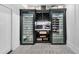 Sleek, climate-controlled wine cellar featuring a built-in rack and glass-front refrigerators at 151 Brailsford St, Charleston, SC 29492