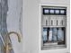 WineStation unit with marble backsplash and gold faucet in modern kitchen area at 151 Brailsford St, Charleston, SC 29492