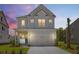 Charming two-story home featuring a two-car garage and appealing architectural details at 1724 Grovehurst Dr, Charleston, SC 29414