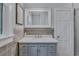 Elegant bathroom with marble vanity and tile flooring, paired with a decorative mirror at 1860 Pinopolis Rd, Pinopolis, SC 29469