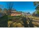 Spacious backyard featuring a large lawn, privacy fence, and mature trees at 204 E Edgefield Dr, Summerville, SC 29483