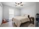 Bedroom with hardwood floors, ceiling fan, and window offering natural light at 204 E Edgefield Dr, Summerville, SC 29483
