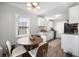 Eat-in kitchen with white cabinetry, granite countertops, and stainless appliances at 204 E Edgefield Dr, Summerville, SC 29483