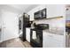 Modern kitchen featuring updated appliances and ample counter space at 204 E Edgefield Dr, Summerville, SC 29483