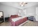 Bright main bedroom featuring wood floors, ceiling fan, and ensuite bathroom at 204 E Edgefield Dr, Summerville, SC 29483