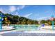 Resort-style pool area with water features, lounge chairs, and plenty of space for relaxation and recreation at 207 Denham St, Summerville, SC 29486