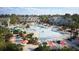 Aerial view of resort-style community featuring a pool, waterslide, clubhouse and lush landscaping at 214 Denham St, Summerville, SC 29486
