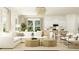 Bright living room features a white sofa, modern chairs, and neutral textures under a chandelier at 214 Denham St, Summerville, SC 29486