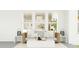 Stylish outdoor space with wicker sofa, plush pillows, chandelier and neutral decor at 214 Denham St, Summerville, SC 29486