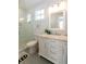 Bright bathroom featuring a glass-enclosed shower and marble countertop vanity at 22 1/2 Mary St # A B C, Charleston, SC 29403