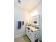 Well-lit bathroom with a marble countertop, a bright vanity, and a sleek, framed mirror at 22 1/2 Mary St # A B C, Charleston, SC 29403