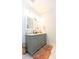Bathroom features a vanity with dual mirrors, marble countertop, and updated fixtures at 22 1/2 Mary St # A B C, Charleston, SC 29403