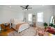 Inviting bedroom with hardwood floors, a cozy rug, and lots of natural light at 22 1/2 Mary St # A B C, Charleston, SC 29403