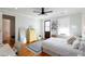 Bright bedroom with hardwood floors, complemented by natural light from the window, offering a cozy space at 22 1/2 Mary St # A B C, Charleston, SC 29403