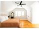 Inviting bedroom with hardwood floors, a ceiling fan, and ample natural light, creating a cozy and serene atmosphere at 22 1/2 Mary St # A B C, Charleston, SC 29403