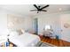 Well-lit bedroom with hardwood floors, a ceiling fan, and a cozy atmosphere, offering a peaceful retreat at 22 1/2 Mary St # A B C, Charleston, SC 29403