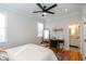 Bright bedroom featuring a work area, large windows, and hardwood floors at 22 1/2 Mary St # A B C, Charleston, SC 29403