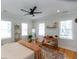 Well-lit bedroom boasts hardwood floors, large windows, and stylish decor at 22 1/2 Mary St # A B C, Charleston, SC 29403