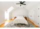 Bright bedroom featuring a ceiling fan, hardwood floors, and a decorative rug at 22 1/2 Mary St # A B C, Charleston, SC 29403