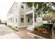 Charming two-story home with double porch, brick sidewalk, and lush landscaping at 22 1/2 Mary St # A B C, Charleston, SC 29403