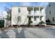 Charming two-story home with double porches and a gravel driveway offering curb appeal at 22 1/2 Mary St # A B C, Charleston, SC 29403
