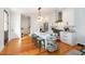 Modern kitchen featuring white cabinets, stainless steel appliances, and an island with bar seating at 22 1/2 Mary St # A B C, Charleston, SC 29403