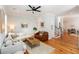 Spacious living room featuring hardwood floors, a ceiling fan, and neutral color palette at 22 1/2 Mary St # A B C, Charleston, SC 29403