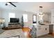 Bright open concept living room with a sleek kitchen, modern fixtures, and stylish decor at 22 1/2 Mary St # A B C, Charleston, SC 29403