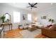 Cozy living room with hardwood floors, neutral colors, and ample seating at 22 1/2 Mary St # A B C, Charleston, SC 29403
