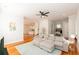 Open-concept living room with a comfortable sectional sofa, hardwood floors, modern decor, and access to the kitchen and dining areas at 22 1/2 Mary St # A B C, Charleston, SC 29403