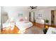 Light-filled main bedroom with hardwood floors and contemporary furnishings at 22 1/2 Mary St # A B C, Charleston, SC 29403