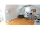 Bright office space with hardwood floors, a desk with monitors, and a sign referencing Meeting and Charlotte Streets at 22 1/2 Mary St # A B C, Charleston, SC 29403