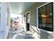 Charming covered front porch perfect for relaxing with outdoor seating at 22 1/2 Mary St # A B C, Charleston, SC 29403